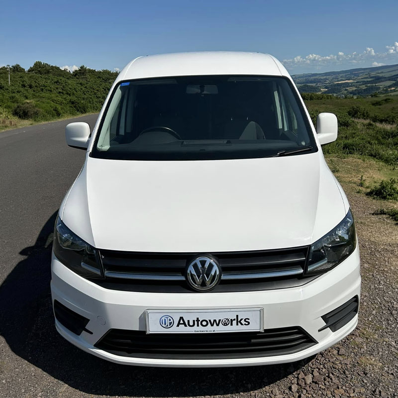 White VW Caddy with DP Autoworks registration plate 